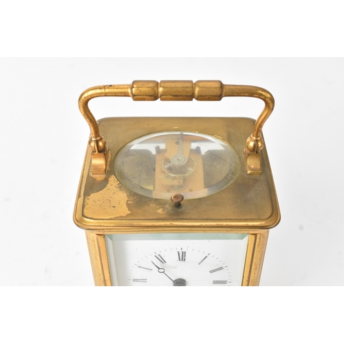50 - A late 19th/early 20th century gilt brass repeater carriage clock, the white enamel dial with Roman ... 