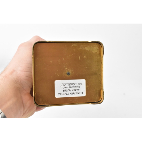 50 - A late 19th/early 20th century gilt brass repeater carriage clock, the white enamel dial with Roman ... 