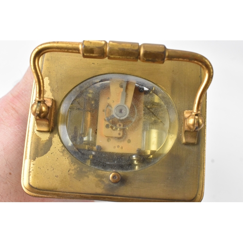 50 - A late 19th/early 20th century gilt brass repeater carriage clock, the white enamel dial with Roman ... 