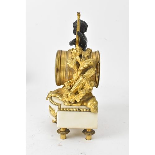 51 - A late 19th century French gilt metal and marble figural mantel clock, the circular enamel dial with... 