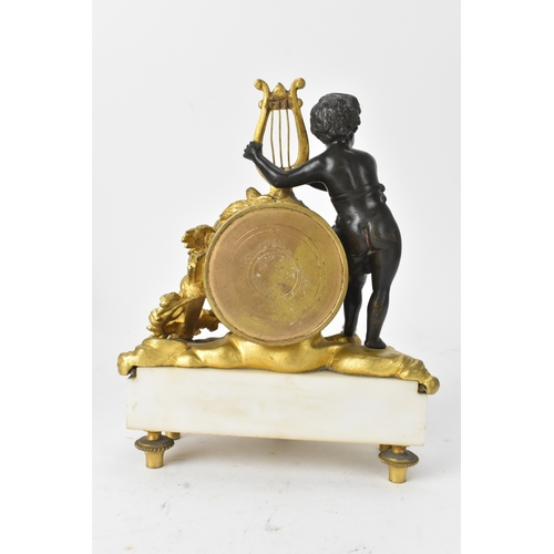 51 - A late 19th century French gilt metal and marble figural mantel clock, the circular enamel dial with... 