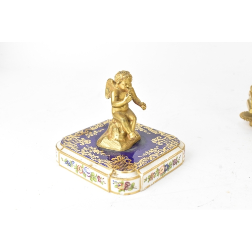 57 - A late 19th century French ormolu and Sevres-style porcelain-mounted mantel clock, the circular dial... 