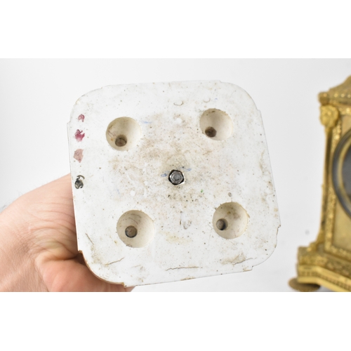 57 - A late 19th century French ormolu and Sevres-style porcelain-mounted mantel clock, the circular dial... 