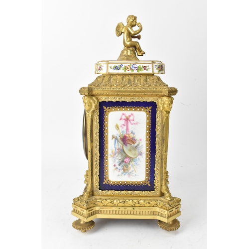 57 - A late 19th century French ormolu and Sevres-style porcelain-mounted mantel clock, the circular dial... 