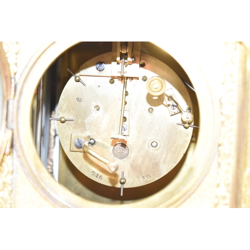 57 - A late 19th century French ormolu and Sevres-style porcelain-mounted mantel clock, the circular dial... 