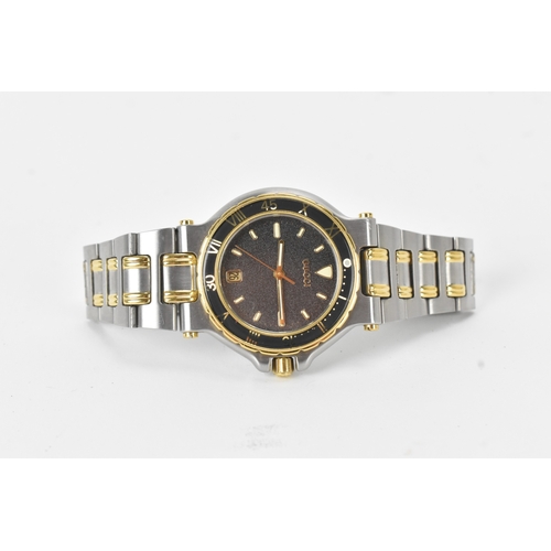 8 - A Gucci 9700M, quartz, gents, stainless steel and gold-plated wristwatch, circa 1995, the textured b... 
