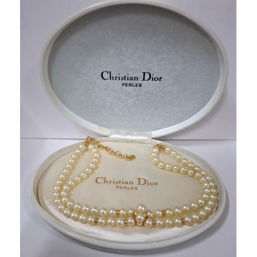 Christian Dior- A 2 strand simulated pearl necklace having a gold tone clasp and CD pendant on chain stamped Chr Dior C Germany together with branded box. Location:Cab
If there is no condition report, please request
