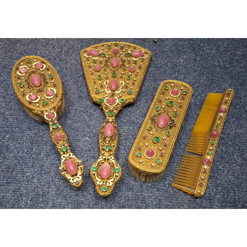A mid 20th Century Continental cased 4-piece bejewelled dressing table set. Location:BWR
If there is no condition report, please request