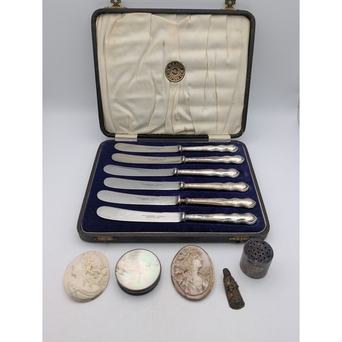 A mixed group to include two cameos, one mounted in gold plated trim, a set of six silver handled butter knives A/F in a fitted case and others
Location: A4M
If no condition report is shown, please request
