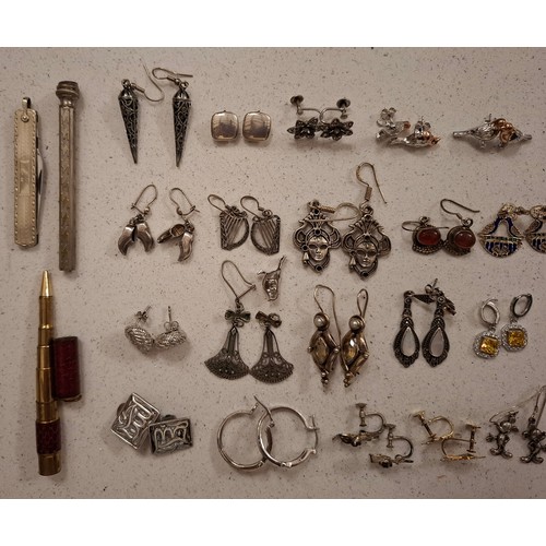 41 - A group of silver and white metal chains (minimum 50g), mixed pendants to include silver examples, s... 
