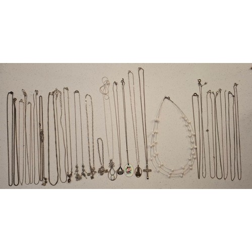 42 - A quantity of costume jewellery to include a silver tone chain with Disney pendant, silver tone and ... 