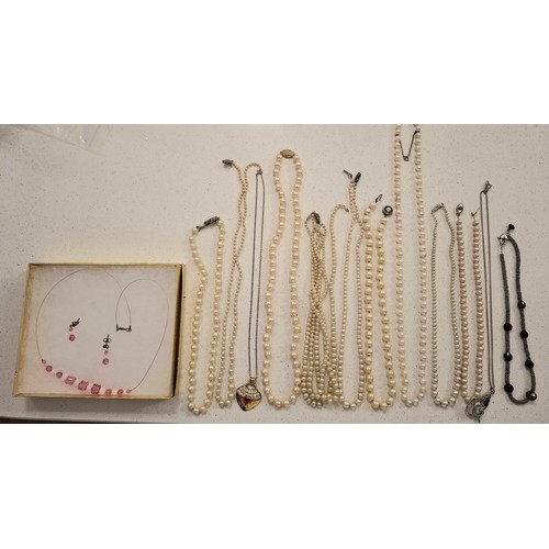 42 - A quantity of costume jewellery to include a silver tone chain with Disney pendant, silver tone and ... 
