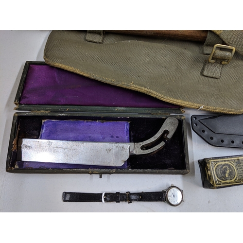 A mixed military lot to include WW2 British Sten Gun magazine loading ...
