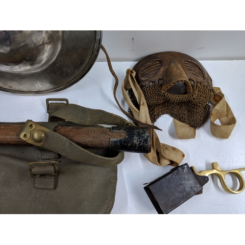 A mixed military lot to include WW2 British Sten Gun magazine loading ...