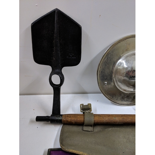 A mixed military lot to include WW2 British Sten Gun magazine loading ...