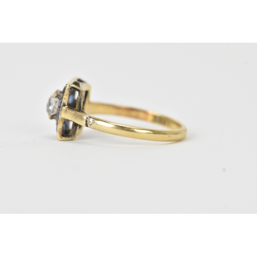 13 - A sapphire and diamond 18ct gold cluster ring, set with an oval old-cut diamond within a border of t... 