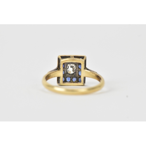 13 - A sapphire and diamond 18ct gold cluster ring, set with an oval old-cut diamond within a border of t... 