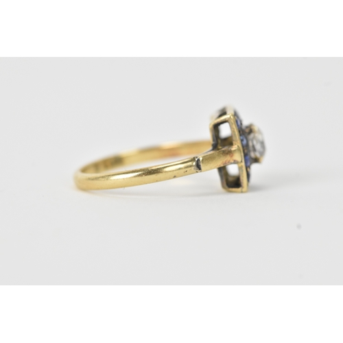 13 - A sapphire and diamond 18ct gold cluster ring, set with an oval old-cut diamond within a border of t... 