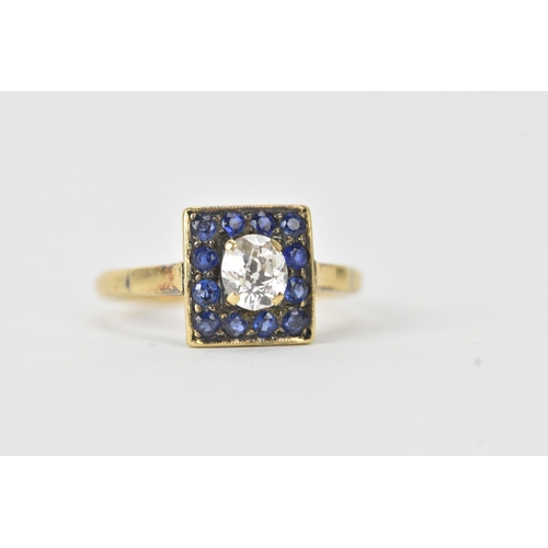 13 - A sapphire and diamond 18ct gold cluster ring, set with an oval old-cut diamond within a border of t... 