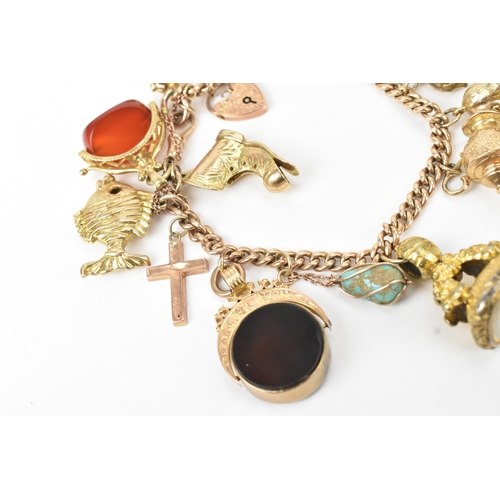 17 - A 9ct gold curb link charm bracelet, fitted with mixed charms to include fobs, teapot, boot, horse a... 