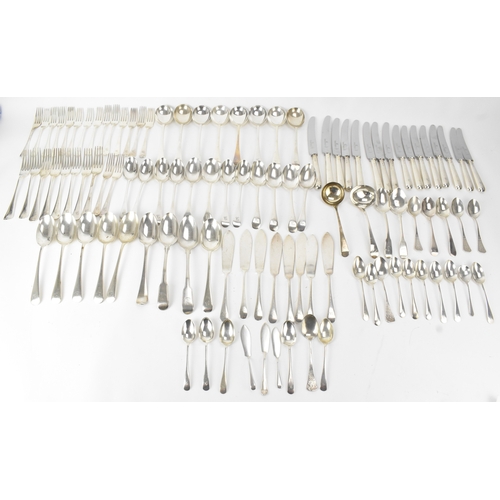 A selection of silver cutlery, various makers and date marks to include a pair of George III silver fiddle pattern dessert spoons, two George III ladles, various table forks, soup spoons, tea spoons, knives and others, combined weight excluding the stainless steel bladed knives 4063.2 grams 
If there is no condition report shown, please request