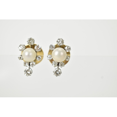 3 - A pair of pearl and diamond cluster earrings, each centred with a round pearl (possibly natural), me... 