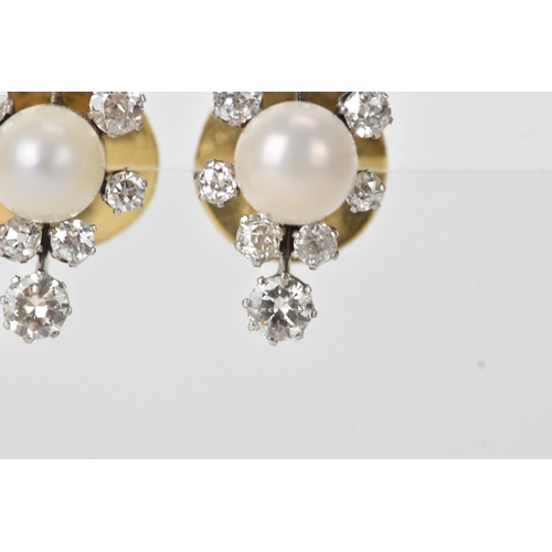 3 - A pair of pearl and diamond cluster earrings, each centred with a round pearl (possibly natural), me... 