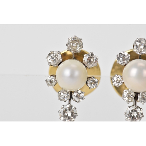 3 - A pair of pearl and diamond cluster earrings, each centred with a round pearl (possibly natural), me... 