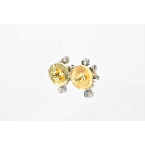 3 - A pair of pearl and diamond cluster earrings, each centred with a round pearl (possibly natural), me... 