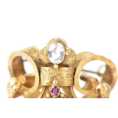 44 - A Victorian yellow metal brooch, unmarked, set with oval and pear-shaped aquamarines and accented wi... 