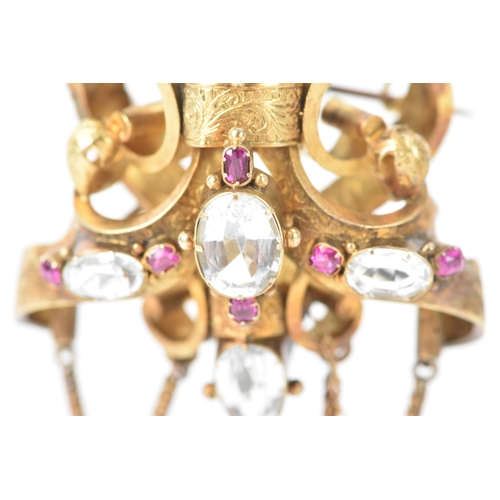 44 - A Victorian yellow metal brooch, unmarked, set with oval and pear-shaped aquamarines and accented wi... 
