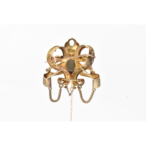 44 - A Victorian yellow metal brooch, unmarked, set with oval and pear-shaped aquamarines and accented wi... 