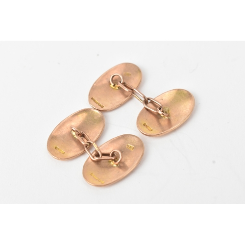45 - A pair of 9ct gold cufflinks, each having chain links with oval formed ends, 5.6 grams 
If there is ... 