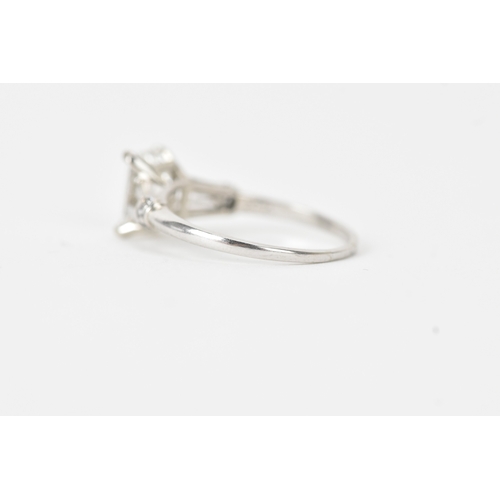 5 - A 1.47ct baguette cut diamond engagement ring, with De Beers Diamond Grading report stating the cent... 