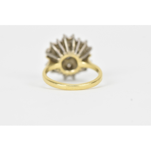 51 - A diamond 18ct gold cluster ring, the central brilliant-cut diamond measuring approximately 4.5mm di... 