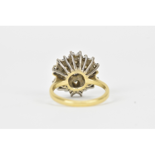 51 - A diamond 18ct gold cluster ring, the central brilliant-cut diamond measuring approximately 4.5mm di... 