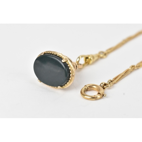57 - A 9ct gold Albert pocket watch chain with fob, the chain formed of elongated engine-turned links, wi... 