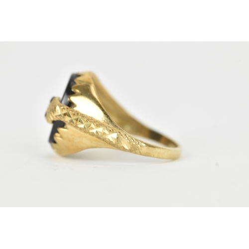 58 - A 9ct gold snake-set onyx ring, the oval onyx panel mounted within a textured bezel, the curling ser... 