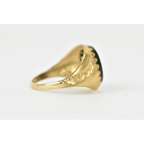 58 - A 9ct gold snake-set onyx ring, the oval onyx panel mounted within a textured bezel, the curling ser... 