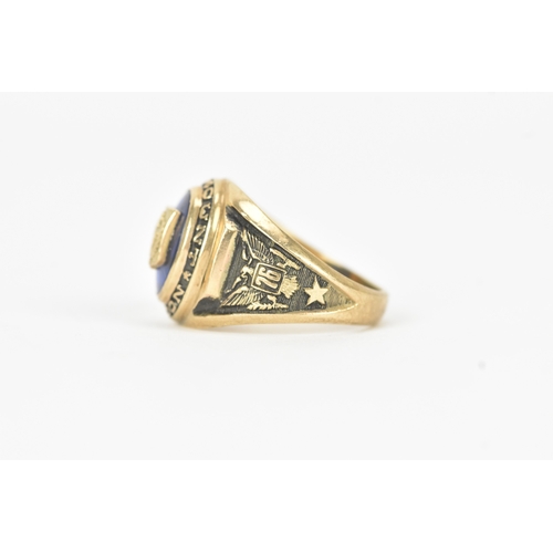 60 - A 10ct gold Marymount London class ring, set with a blue synthetic panel centred by a relief school ... 