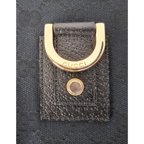 1 - Gucci- A 1990's GG black canvas Abbey D-Ring crossbody bag with black leather trim and shoulder stra... 