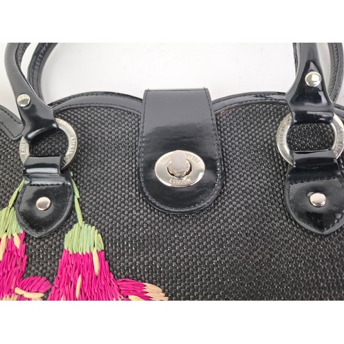 10 - Lulu Guiness- A black coated bag with rattan embroidered hummingbird and fuchsia design, 38cm wide x... 