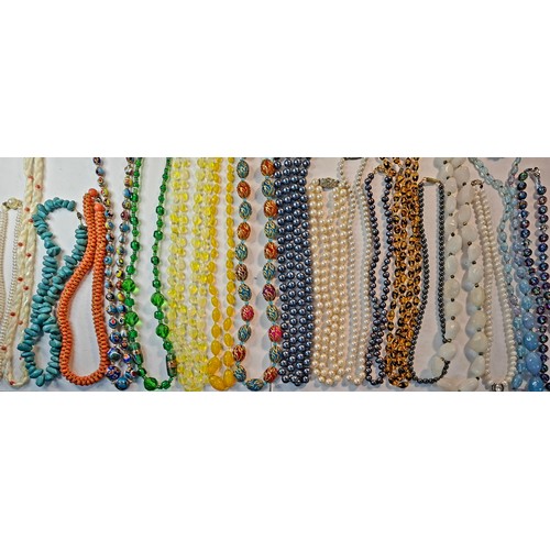 60 - Vintage bead necklaces to include painted glass examples, a mid 20th Century coral necklace, pearl n... 