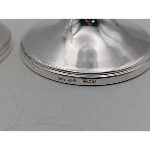 19 - A pair of Elizabeth II cut glass and silver filled bud vases, Birmingham 1985/86 marks for Broadway ... 