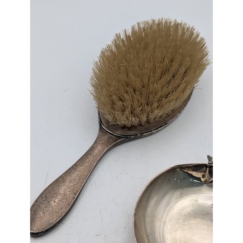 21 - Silver items to include a George V Deakin and Francis silver clad dressing table brush Birmingham 19... 