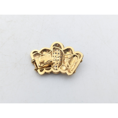 24 - An 18ct yellow gold and diamond clasp from a  bracelet stamped 750, 6.9g
Location:C3
If there is no ... 