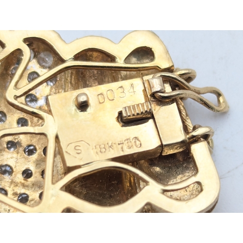 24 - An 18ct yellow gold and diamond clasp from a  bracelet stamped 750, 6.9g
Location:C3
If there is no ... 
