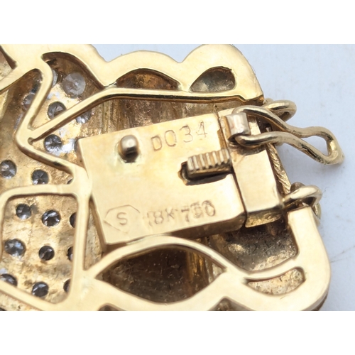 24 - An 18ct yellow gold and diamond clasp from a  bracelet stamped 750, 6.9g
Location:C3
If there is no ... 