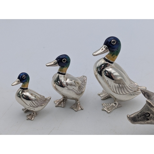 4 - Silver collectables to include a pepper pot fashioned as a pig together with three silver and enamel... 