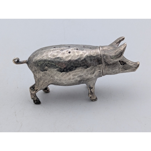 4 - Silver collectables to include a pepper pot fashioned as a pig together with three silver and enamel... 